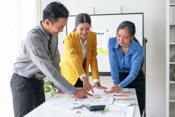 Group of diverse professionals collaborating on a business project. Office teamwork, planning...