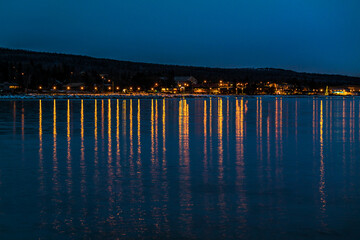 Small Town at Night with Lights Reflecting in the Bay