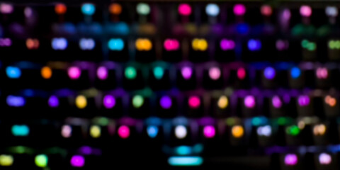 abstract background: glowing keys of a mechanical keyboard blurred