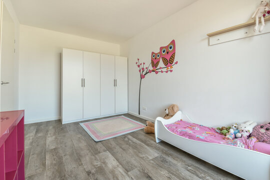 Bright and cheerful child bedroom with cute wall decals