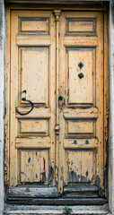 Old and traditional wooden door in Puertollano, Ciudad Real Province, Castilla-La Mancha, Spain