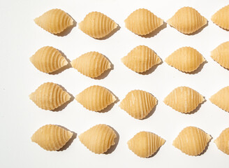 Geometry flatlay minimal composition of organic raw  Conchiglie Rigate pasta