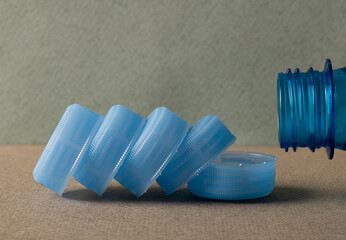 Plastic caps for plastic bottles. Plastic raw materials.