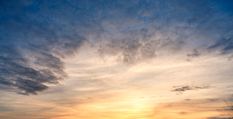 Obraz premium sunrise sky with gentle colorful clouds. Real amazing panoramic sunrise or sunset sky.