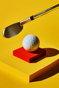 Golf ball and club on vibrant yellow background. Generative AI image
