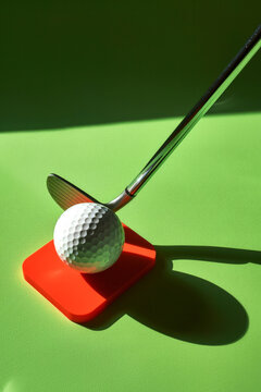 Teeing off a golf ball with shadow play. Generative AI image