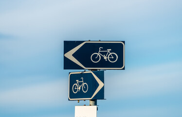 Signs pointing the way to bike paths.