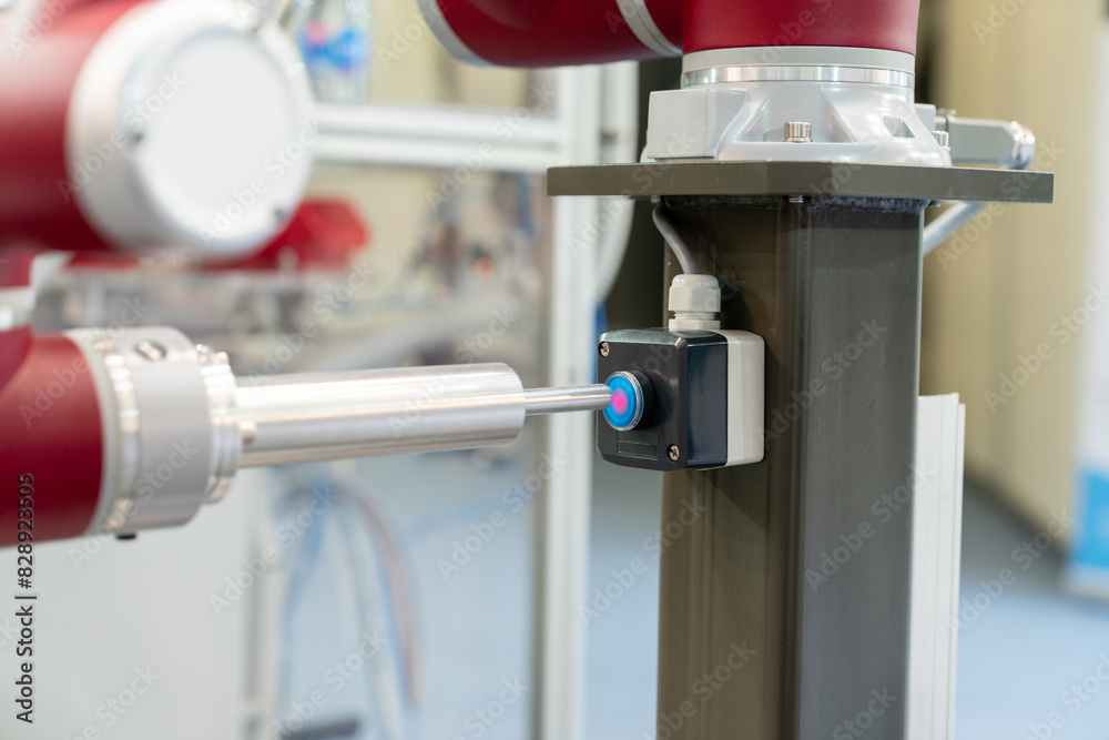 Aufkleber industrial robot presses the button. accuracy calibration.