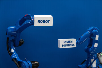 Robot arms on a blue background. Smart industry concept..