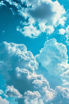 Clear blue sky with soft, fluffy clouds, perfect for a calming and peaceful background effect
