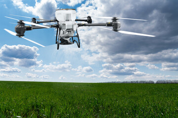 Spreading agricultural drone flies over the field and spreads fertilizer. Smart farming and...