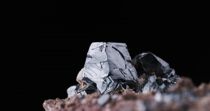 hematite crystals footage. From Wessels Mine, Kalahari Manganese, South Africa. on black background. macro detail close-up rough raw unpolished semi-precious gemstone.
