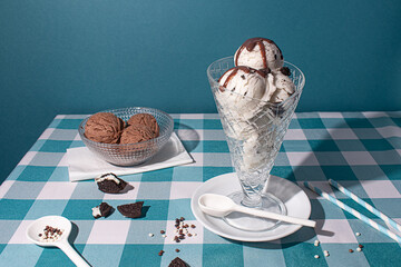 Delectable ice cream and cookies on a checkered tablecloth