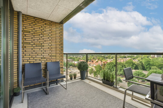 Balcony View of Urban Landscape with Modern Furniture