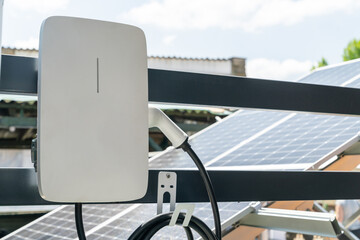 Electric vehicles charging station that takes energy from solar panels. Close up..