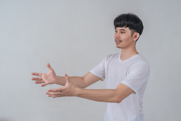 Handsome young man showing his hands gestures.