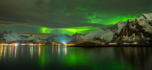 landscape with lake and mountains and northern light Lofoten