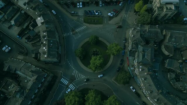 Aerial view of tha cars driving on the roundbound
