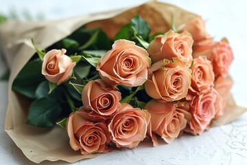 Obraz premium Bouquet of light pink roses in a kraft paper envelope isolated on a white background