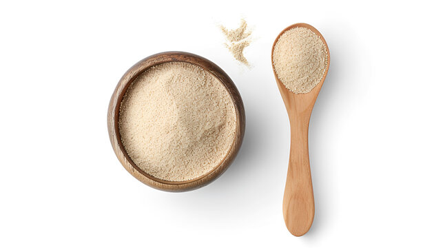 Bowl and spoon with active dry yeast isolated on white, top view