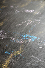 
scratched black background with colored spots corner view