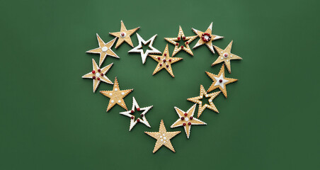 Christmas handmade cookies in the shape of a star, decorated with ornaments, with icing and...