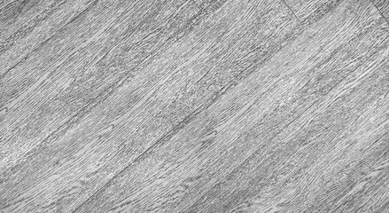 close up view of grey oak wood texture. wood grain background in diagonal pattern. oblique monochrome wooden pattern background with blank space for design.