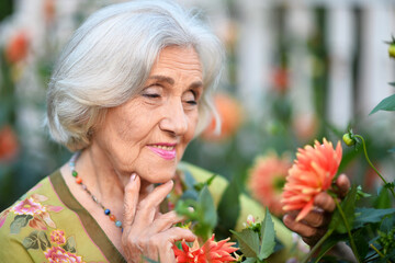 Portrait of a beautiful woman in the park in summer