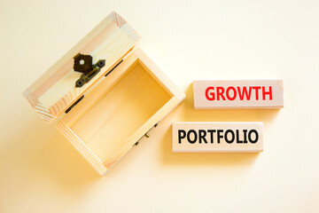 Growth portfolio symbol. Concept words Growth portfolio on beautiful wooden block. Beautiful white paper background. Empty wooden chest. Business Growth portfolio concept. Copy space.