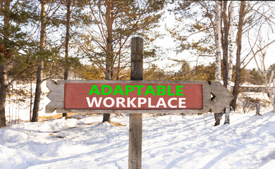 Adaptable workplace symbol. Concept words Adaptable workplace on beautiful wooden road sign. Beautiful winter forest snow tree background. Business Adaptable workplace concept. Copy space.