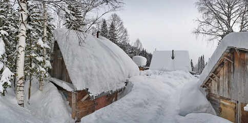 Russia. Kuznetsk Alatau. Winter view of the holiday village of Borisovka among the snow-covered...