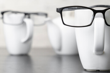 Simulation scene simulating human relationships using cups with glasses