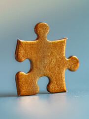 Obraz premium A single wooden puzzle piece standing upright.