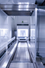 Obraz premium Empty Airport security checkpoint, x-ray scanner machine with baggage conveyor belt