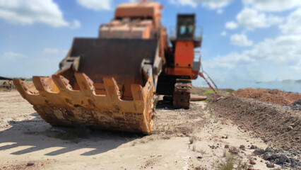 blurry foto of monster excavator shovel which has been retired and made into a monument at the mine. shoot from low angle © Yudi