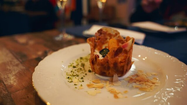 Experience a Sophisticated Gourmet Plated Dish with Elegant Presentation in a Fine Dining Setting
