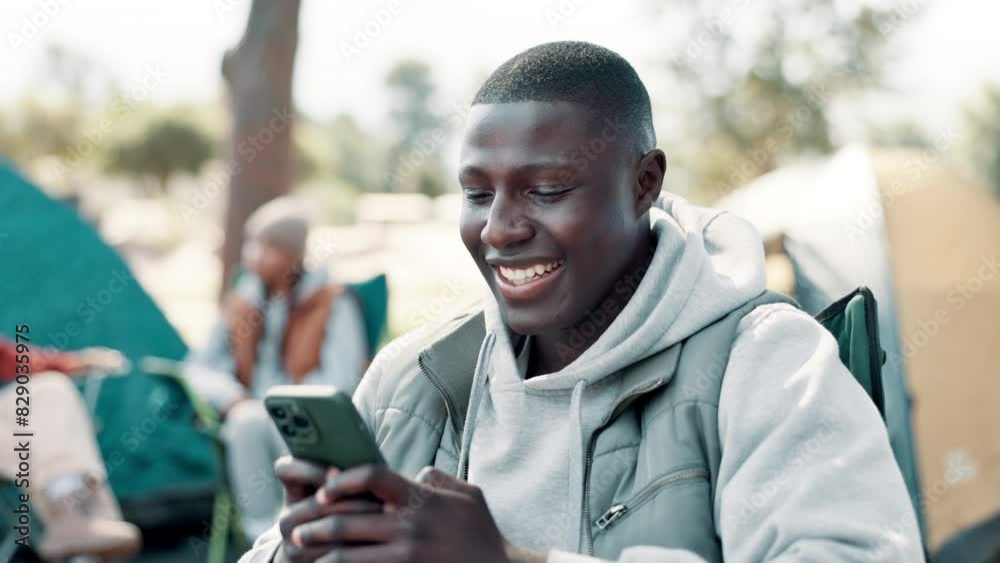 Poster Camping, phone and black man by tent with friends for holiday, vacation and adventure outdoors. Travel, campsite and person on smartphone for social media to relax in countryside, nature and forest