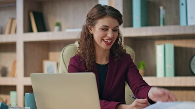 Successful executive talk videocall at modern workplace. Smiling manager study