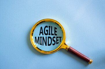 Agile Mindset symbol. Magnifying glass with words Agile Mindset. Beautiful blue background....