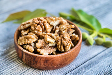 Raw Walnuts in a wooden bowl