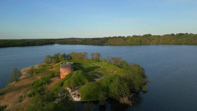 A drone view of The old Castle at Manor House Hald Hovedgaard, Viborg, Denmark. Springtime view at Hald, So, Dollerup Bakker, Viborg. View over Hald Lake from Dollerup bakker. Geological formations.