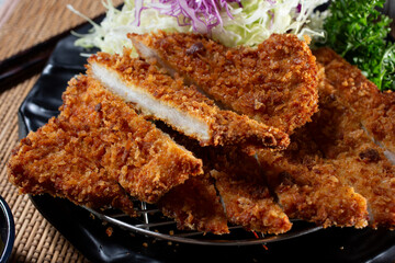 A closeup view of a plate of chicken katsu.