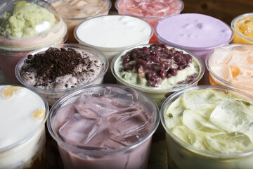 A view of a background of several varieties of milk tea beverages.