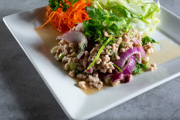 A closeup view of a plate of larb.