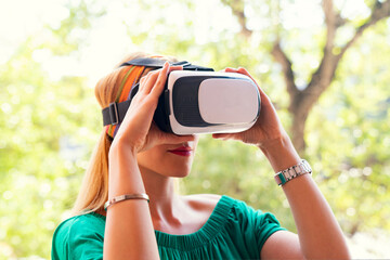 woman wearing vr glasses outside