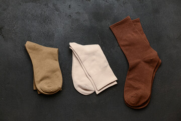 Basic color socks on black grunge background