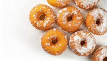 Donuts on white background top view and copy space. Doughnuts whit sugar powder. Tasty baked food