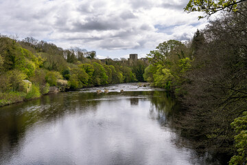 View of Barnard Castle from the river Tees on a cloudy spring day, County Durham, England