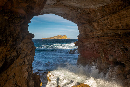 View of S'Espartar island from Sa Figuera cave near Cala Comte beach, San Josep de Sa Talaia, Ibiza, Balearic Islands, Spain