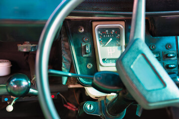 vintage car interior, French classic automobile, dashboard, steering wheel and speedometer